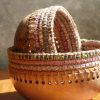 Handmade wooden bowl with crochet